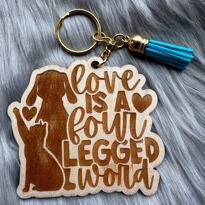Handmade wood keychain with tassel: Love is a four legged word.